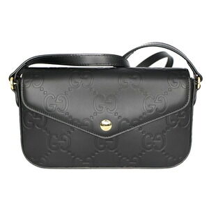 Gucci GG embossed black leather super embossed GG calfskin flap